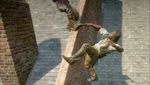 Charles Smith falls backwards from a roof